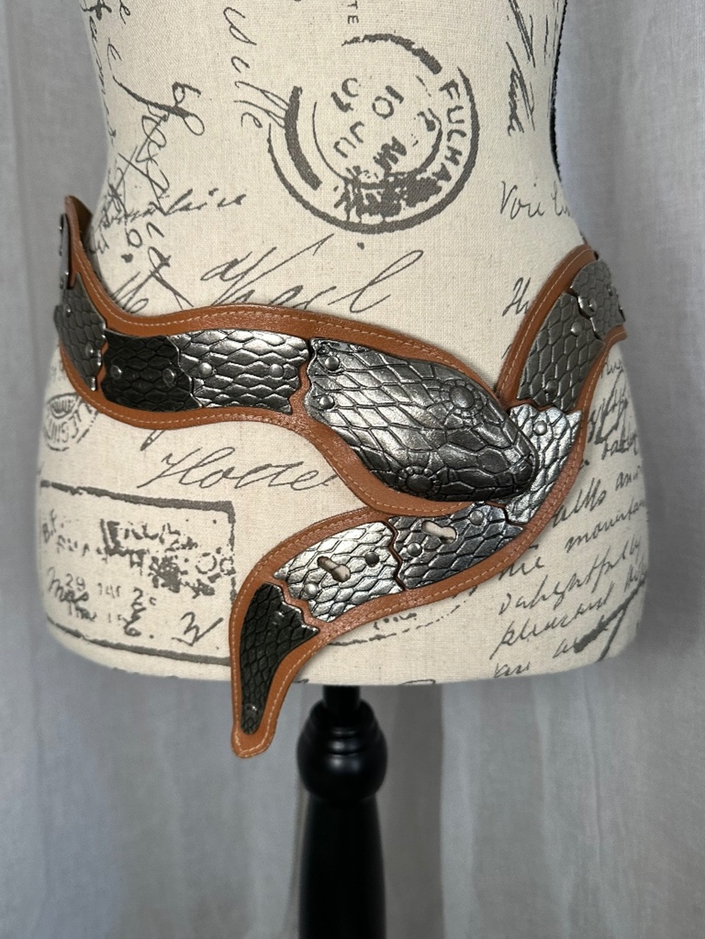 Vintage brown leather and silver colored metal articulated snake belt